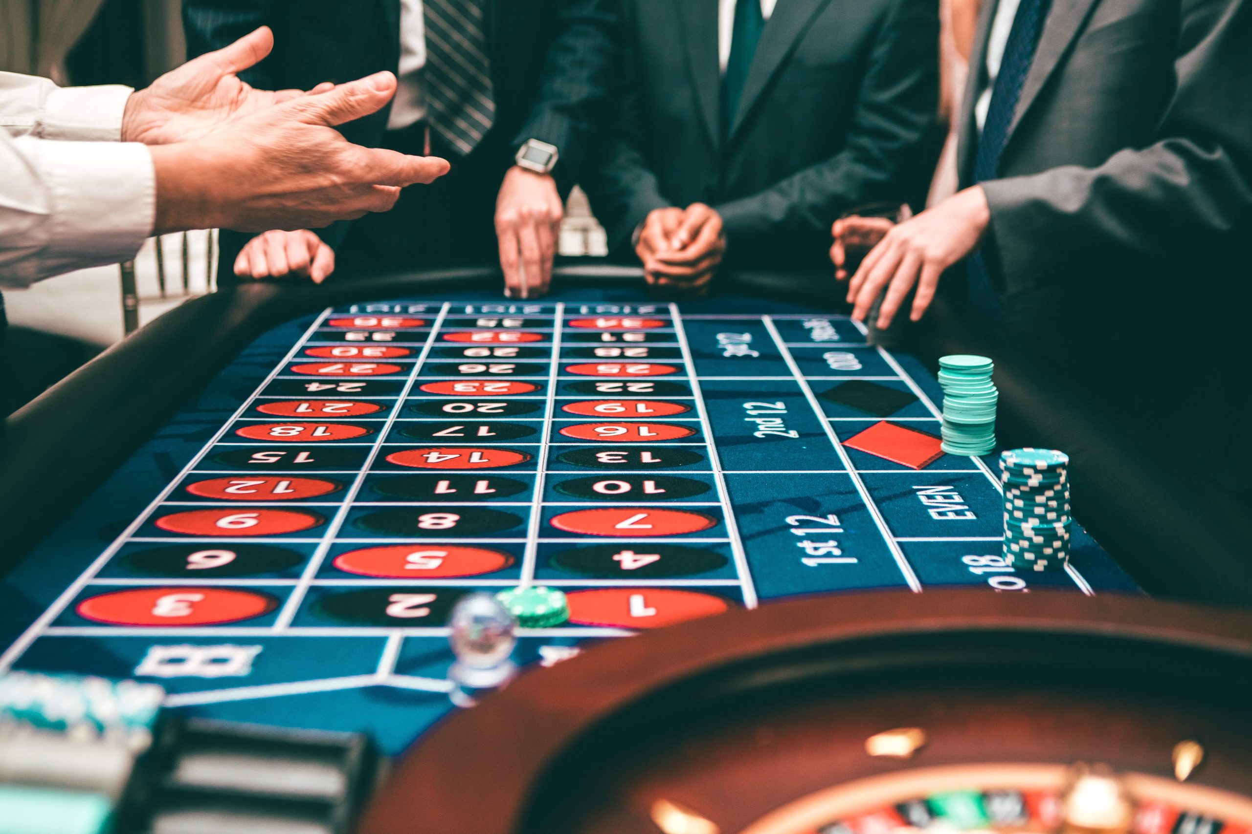 people betting in casino